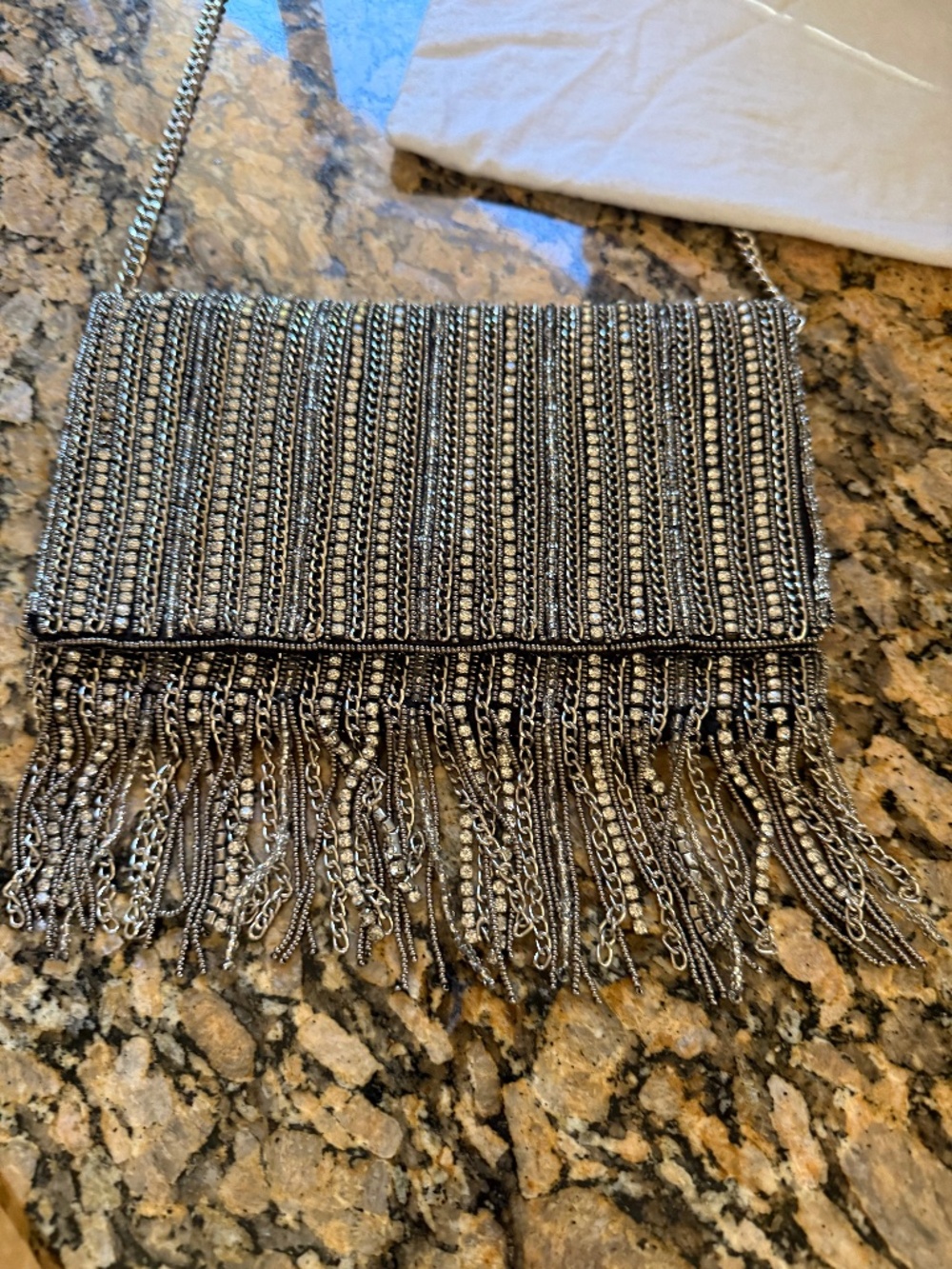 Beaded evening bag with shoulder strap.